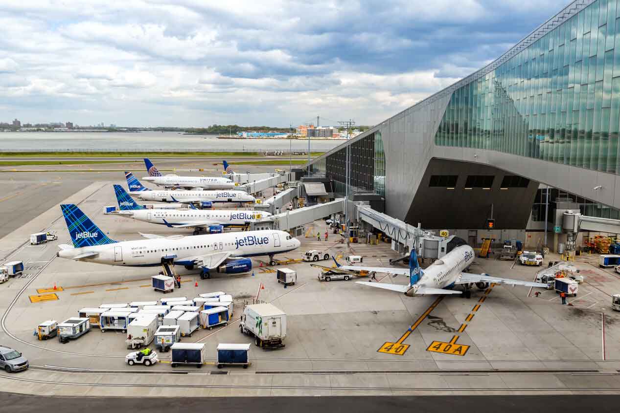 Airplanes parked at LaGuardia Airport terminal gates